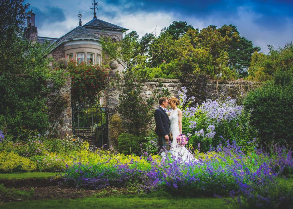 Loch Ness Country House Hotel Wedding Couple standing in walled garden