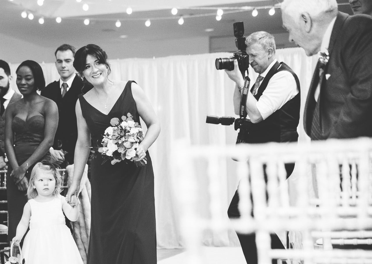 Wedding Photographer photographing wedding entrance