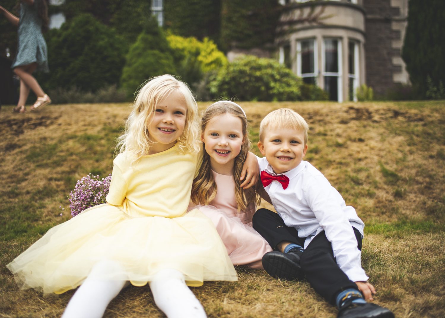 Children posing for the camera at wedding
