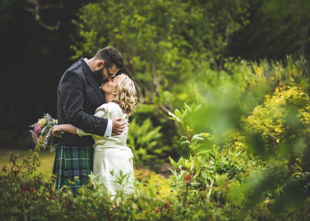 Couple kissing in garden