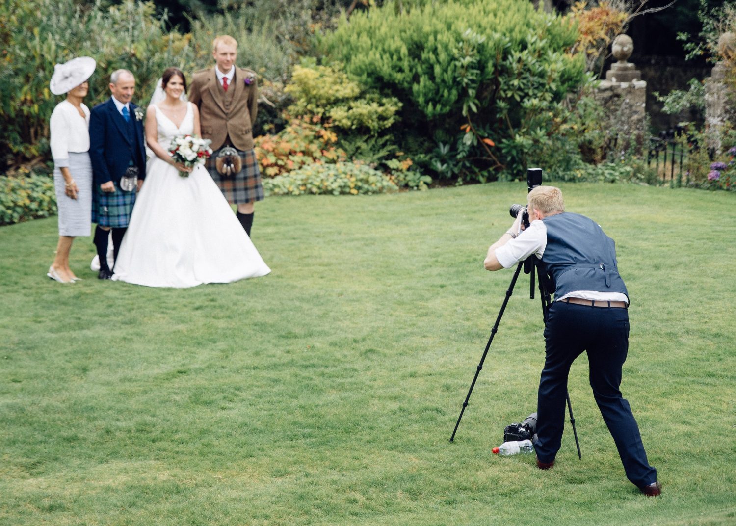 Inverness wedding photographer photographing wedding party