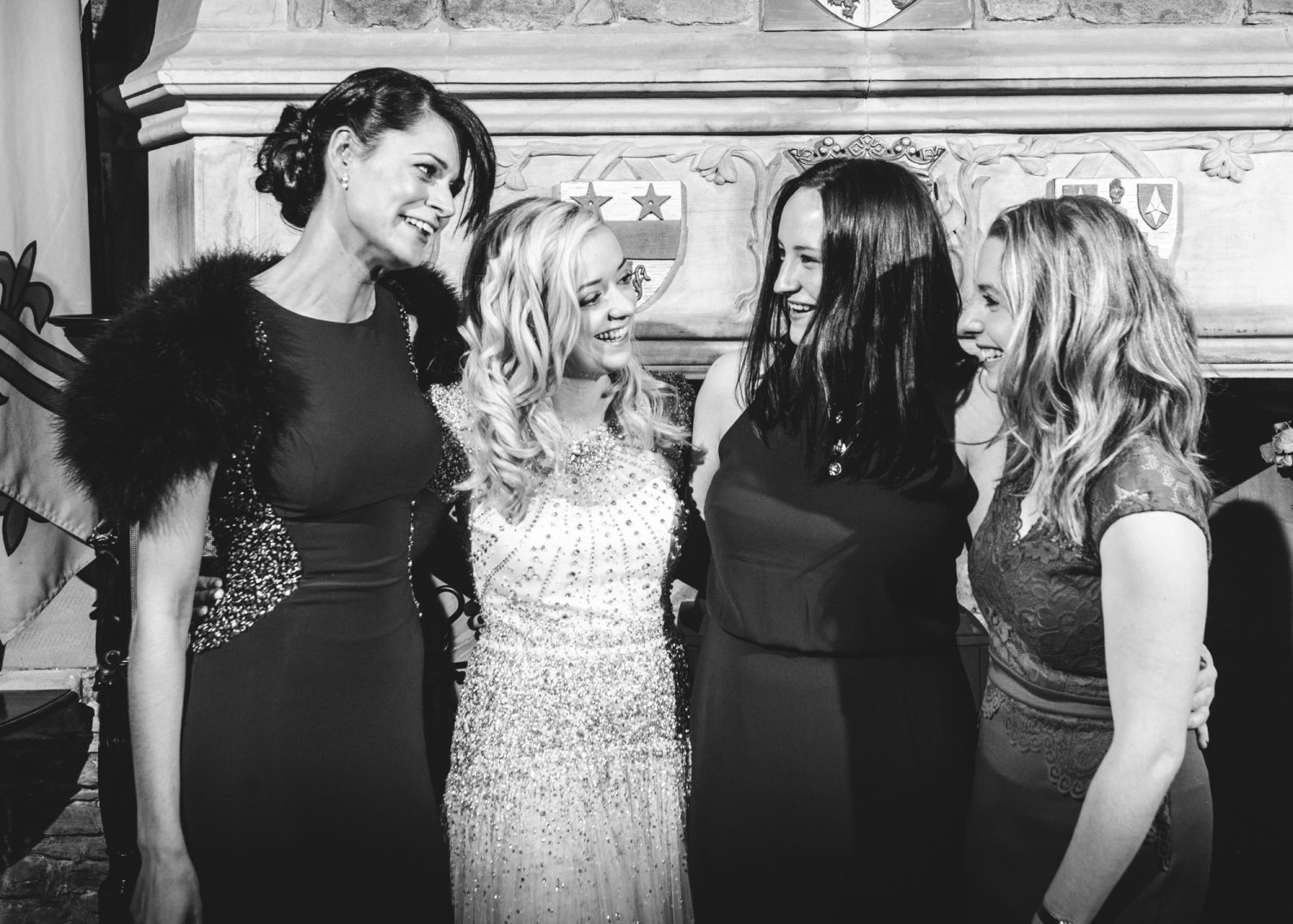 Bride and girlfriends in the banqueting room at Eilean Donan Castle