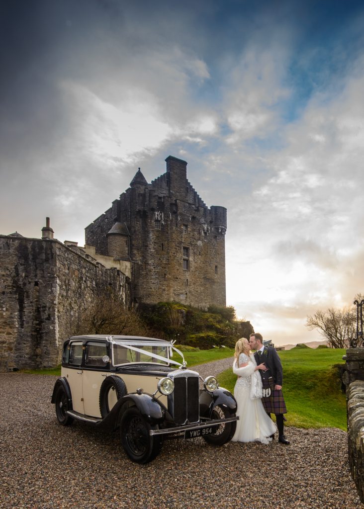 Couple and car outside castle