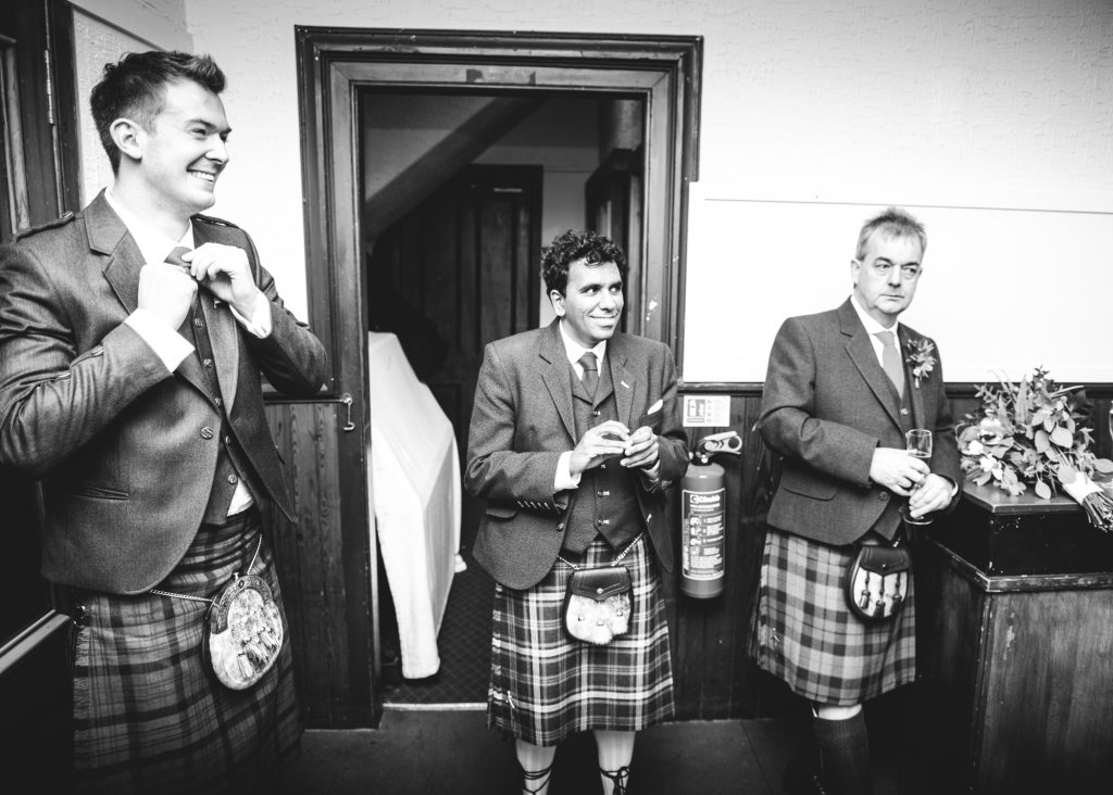 Men in kilts at Portree Village Hall wedding