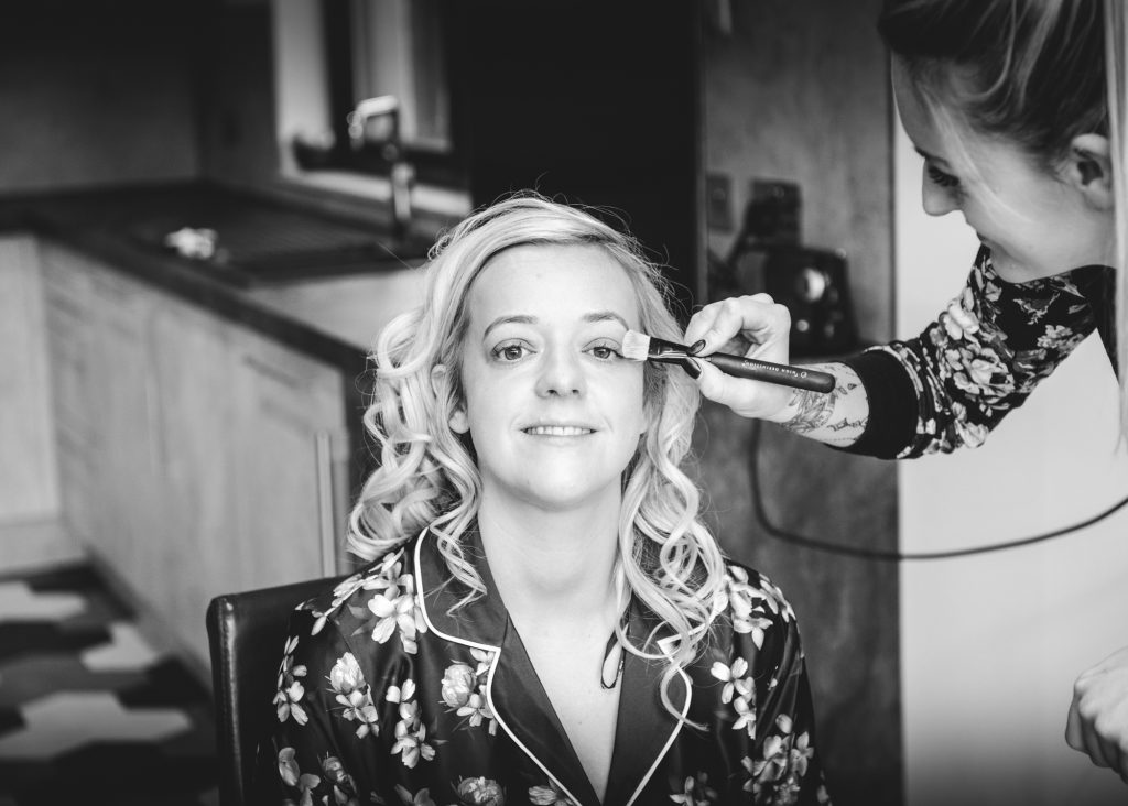Ashley the bride to be having her makeup applied ahead of her Eilean Donan Castle wedding